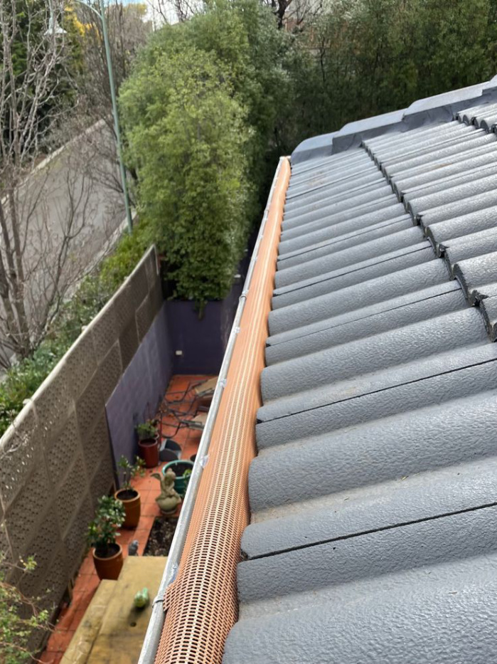 Gutter mesh installed on a tiled roof